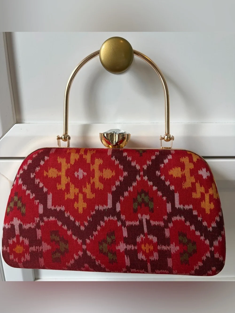 Red Patterned Evening Clutch with Gold Hardware and shoulder chain strap include